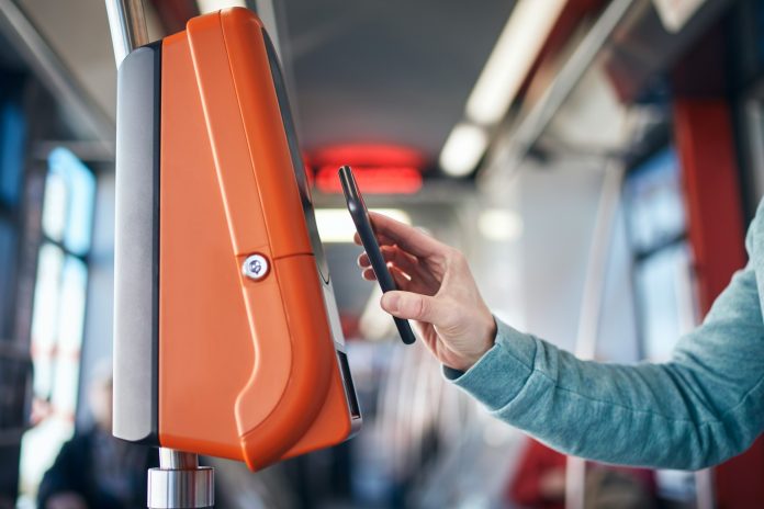 Man buying ticket via digital wallet